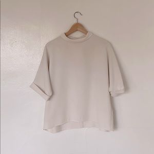 Uniqlo rolled neck white blouse